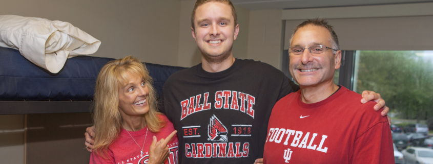 Ball State freshman Cameron DeBlasio poses for a photo with his parents as he moves into DeHority Complex in August.