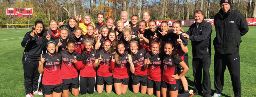 Photo shows players and coaches of Ball State's women's soccer team.