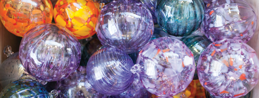 Photo shows an array of glass art.