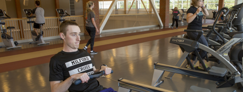 Graduate student Dylan Kanowski uses a rowing machine at the Jo Ann Gora Student Recreation and Wellness Center.