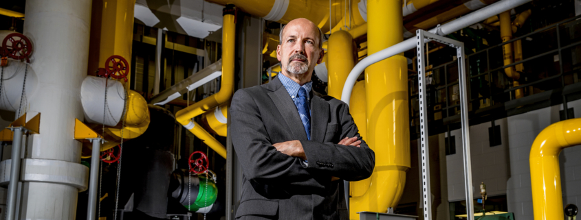 Jim Lowe, Ball State’s associate vice president of facilities planning and management, stands in the belly of the South District Energy Station