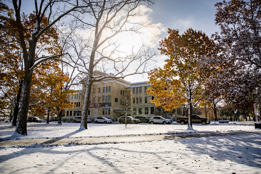 The stately Administration Building is surrounded by snow and sunshine