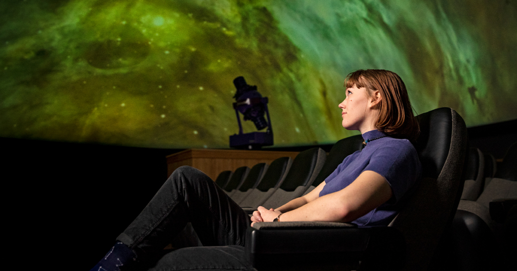 student in the planetarium